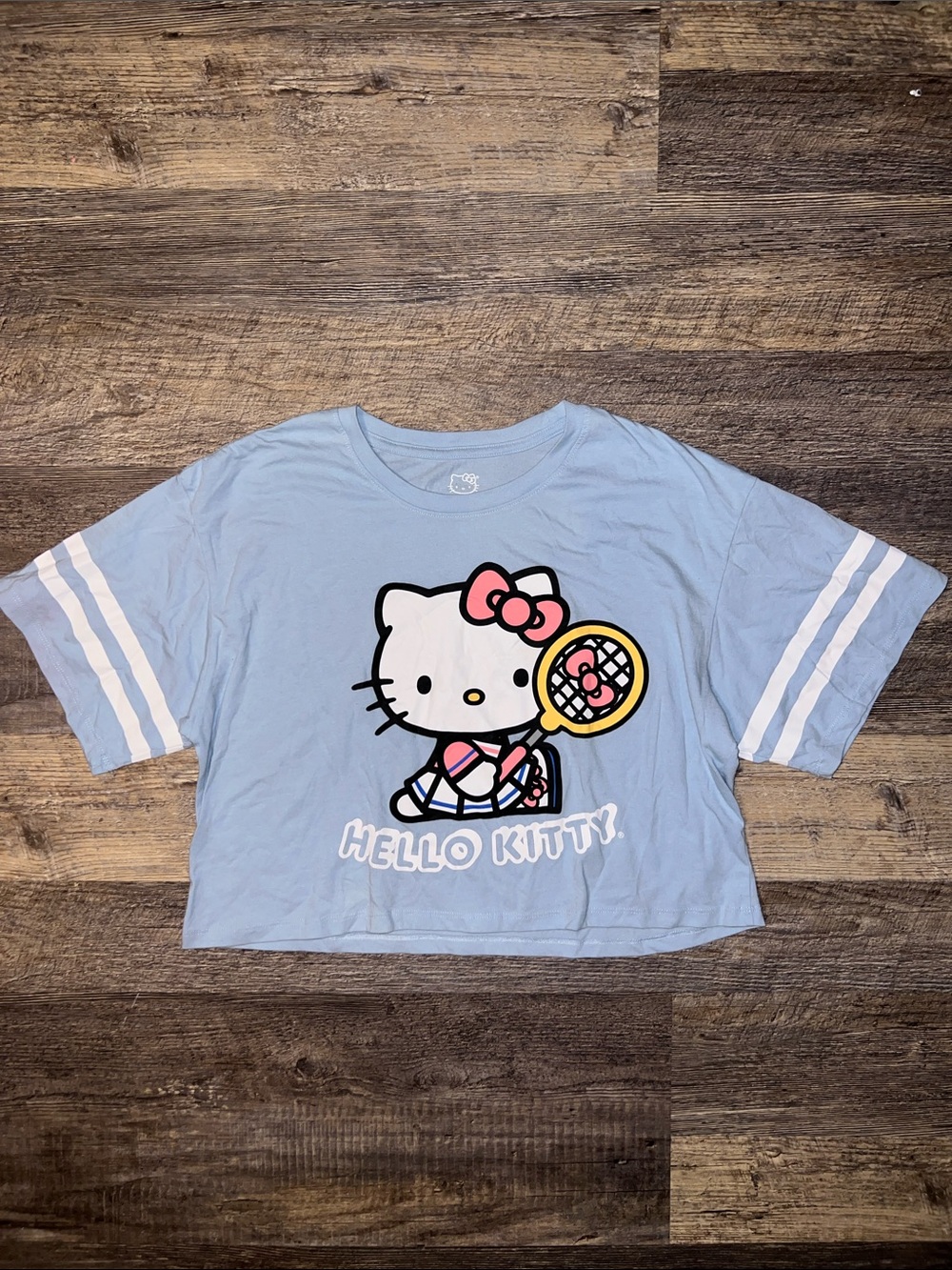 Hello Kitty Light Blue Cropped Tee with Tennis Graphic